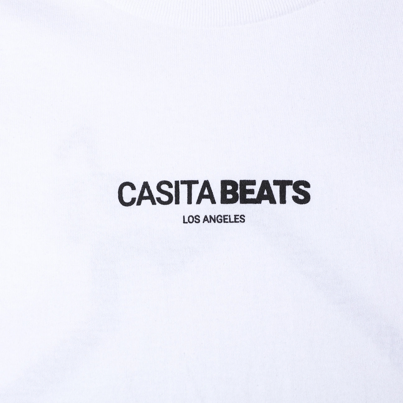 casita beats men's white shirt close up